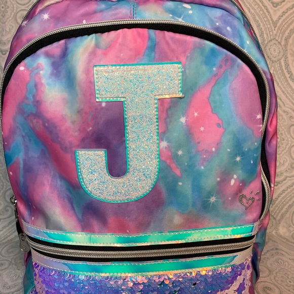 justice initial galaxy backpack
